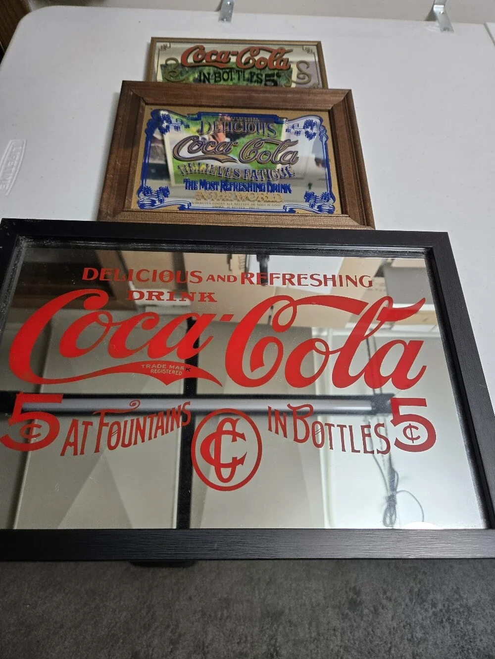 3 Vintage Coke Mirrors. 1 Red Lettering. 1 Blue Lettering. 1 Red & Black Nice.